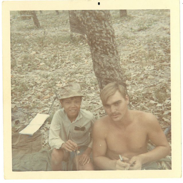 058 Jerry W. Peace and a Vietnam boy.